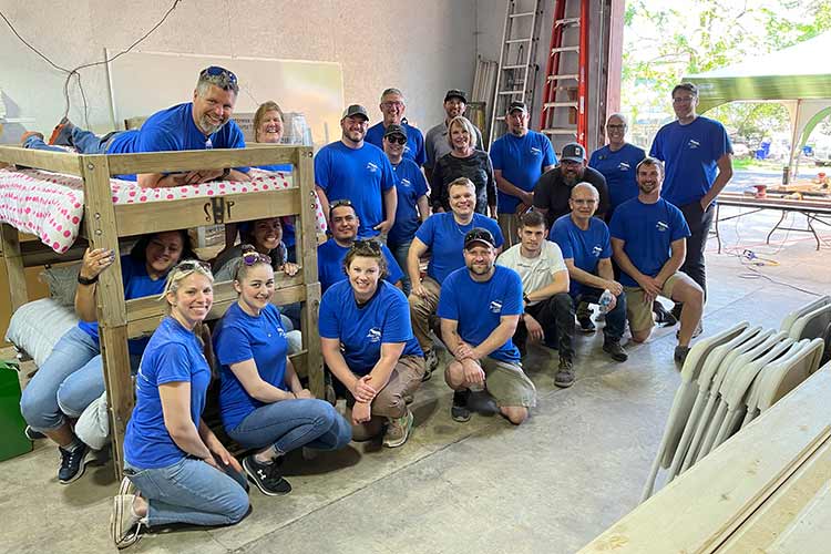 Portland Team Members were all smiles after building bunk beds for Sleep in Heavenly Peace.